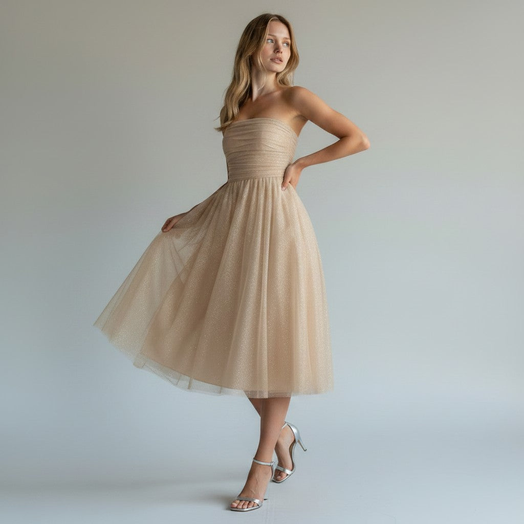 Chic sleeveless sequin midi dress for women, featuring a flowing silhouette. Ideal for summer parties.