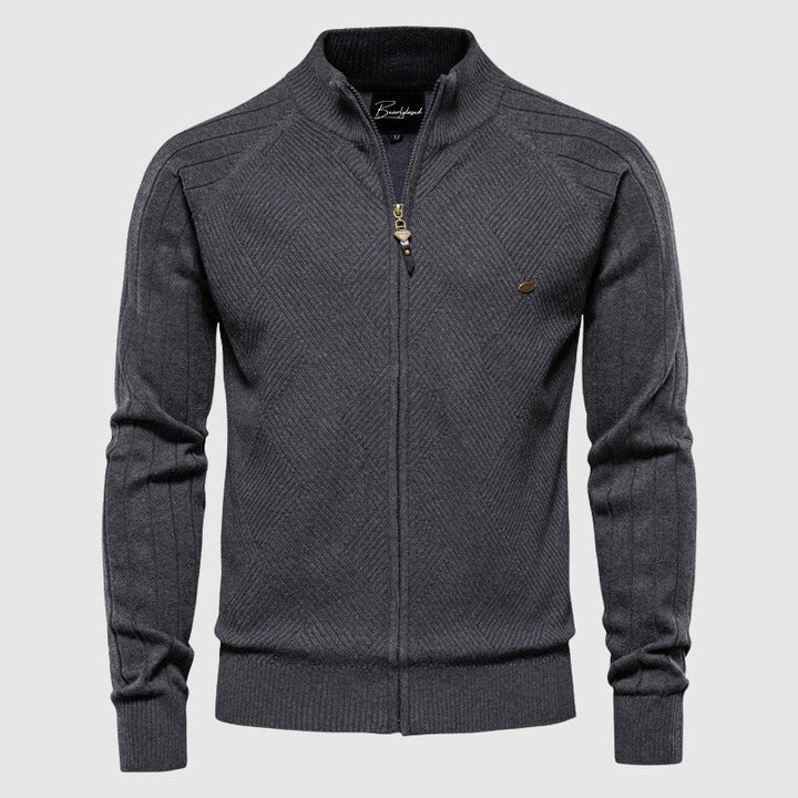 Man wearing a stylish full-zip cardigan sweater. Versatile long-sleeve men's knitwear, ideal for modern autumn layering.