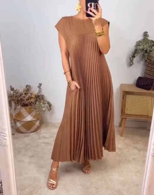 Women's timeless pleated comfort dress. Versatile for both casual and formal occasions.