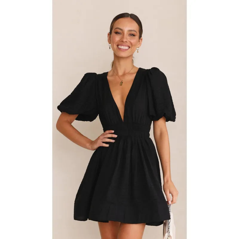 Flattering women's mini summer dress. Elegant, lightweight design perfect for casual day-to-night or holiday wear.