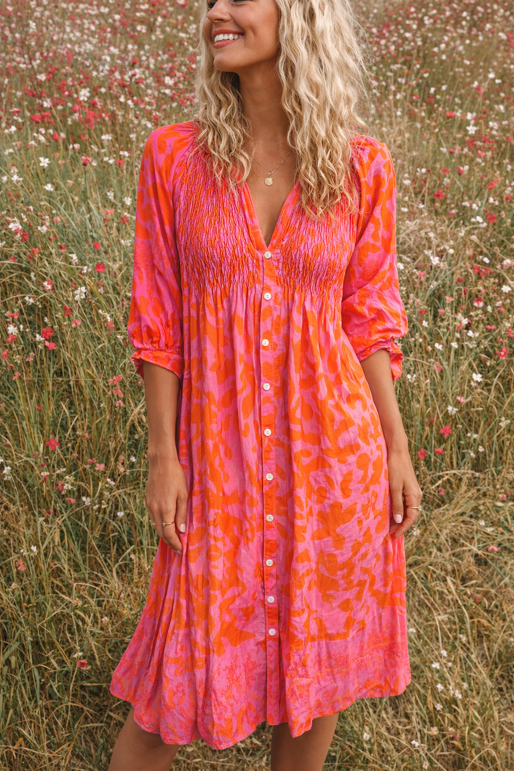Elegant women's orange midi dress, perfect for summer occasions. Features a sophisticated, feminine style.