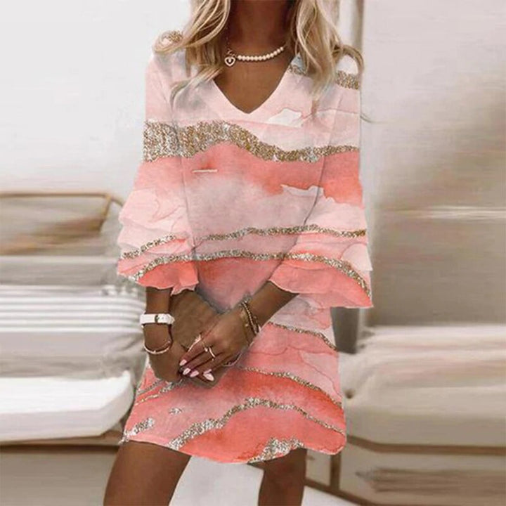 Women's elegant patterned long sleeve dress. Timeless, knee-length style for versatile formal & casual apparel.