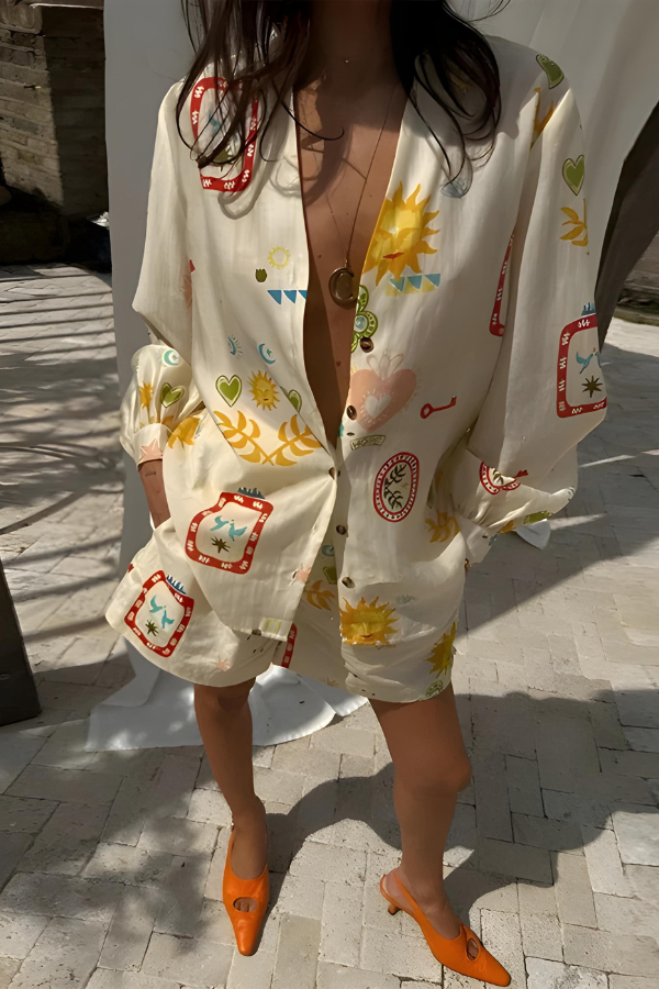 Model in a casual chic women's long sleeve top & high-waisted shorts set, perfect leisurewear with eclectic print.