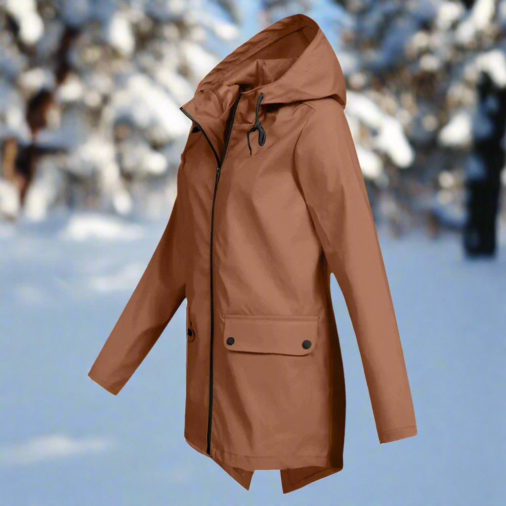 Fashionable women's raincoat, waterproof and hooded, essential for outdoor adventures.