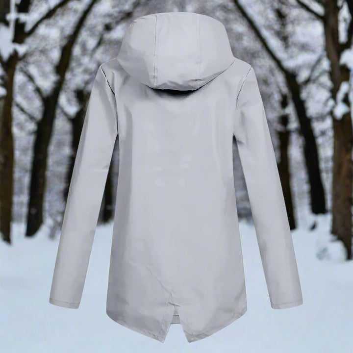 Modern ladies' waterproof raincoat, a hooded and lightweight option for rain protection.