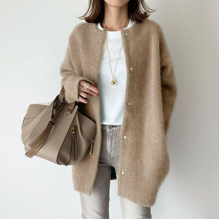 Button-front longline cardigan for women, relaxed fit offers comfort & style as versatile autumn outerwear.