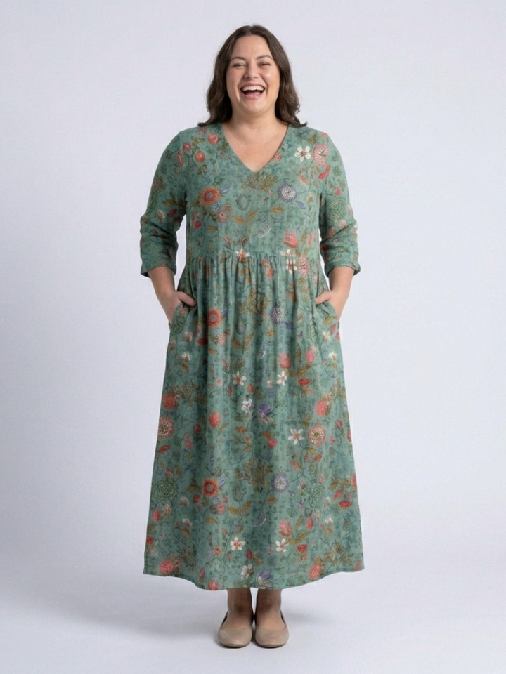 Vibrant floral print women's maxi dress with a flattering V-neck and practical 3/4 sleeves. Perfect casual summer outfit.