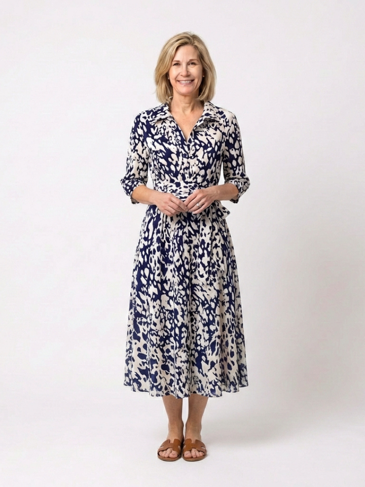 Elegant women's collared long sleeve midi dress with a flattering waist tie, perfect for versatile everyday wear.