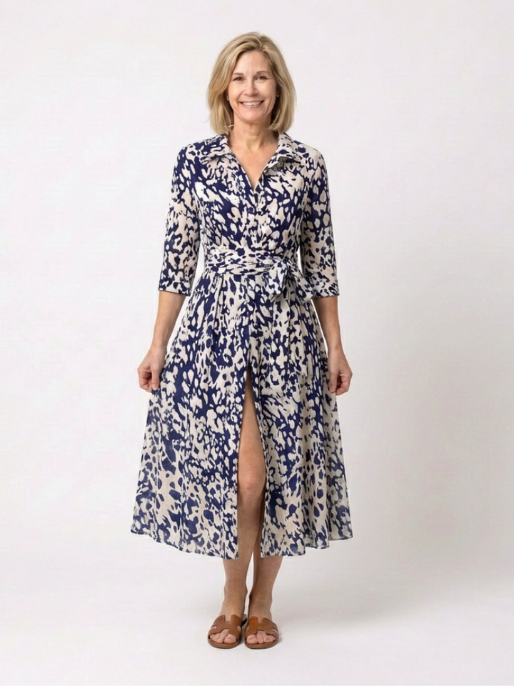 Stylish women's collared midi dress with long sleeves & waist tie. A flattering, versatile piece for modern fashion.