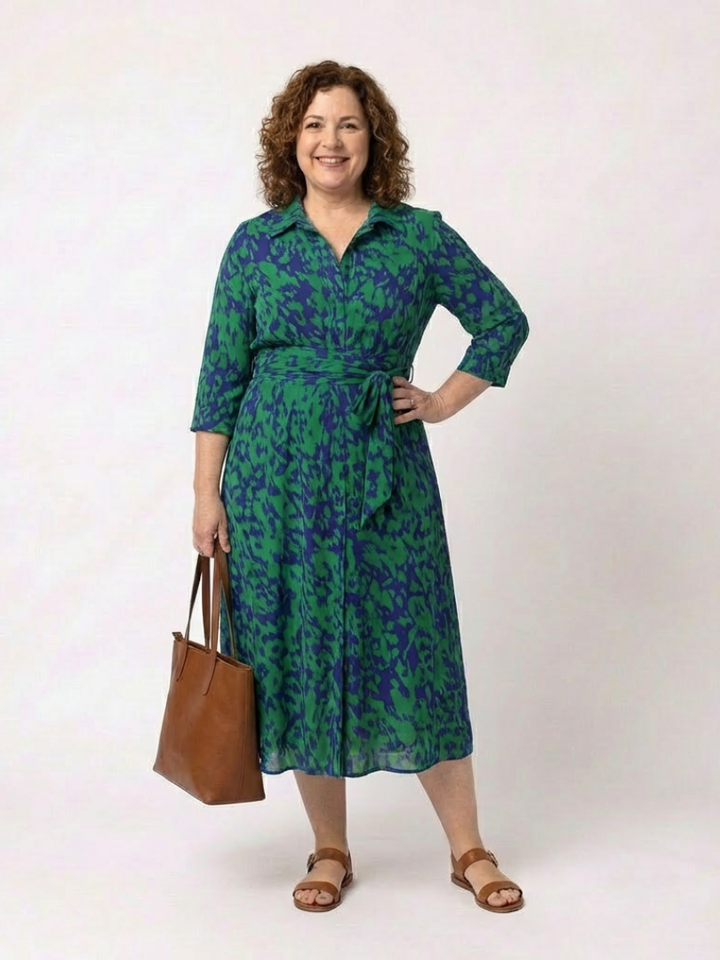 Fashionable women's collared midi dress. Long sleeves & waist tie offer a flattering fit & comfortable elegant style.