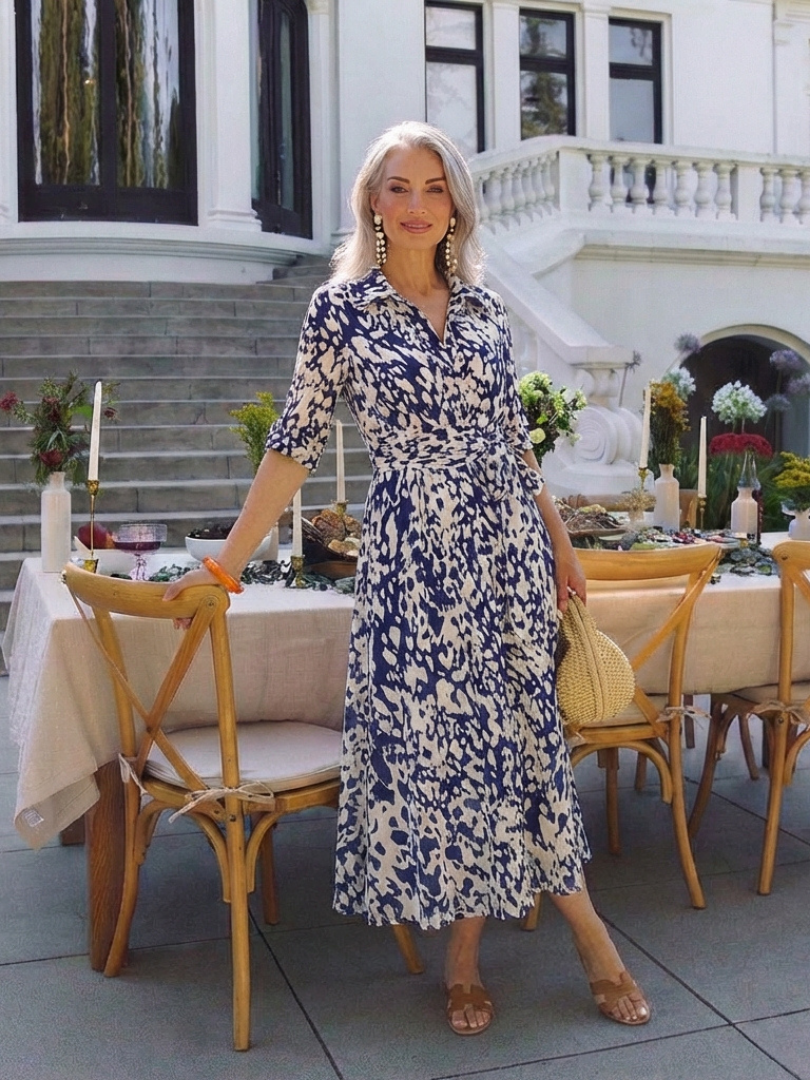 Versatile women's midi dress. Elegant collared design with long sleeves and a waist tie, suitable for any occasion.