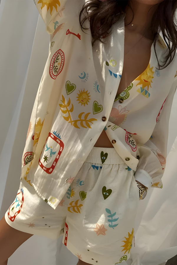 Close-up of the breathable fabric and unique eclectic print on the women's long sleeve shirt and high-waisted shorts set.
