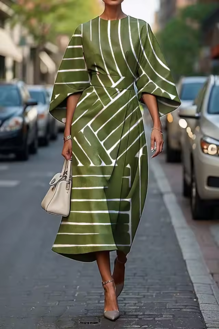Stylish women's midi dress, elegant and versatile, designed with a flattering silhouette for modern fashion.