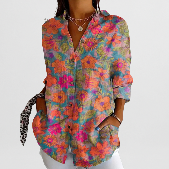 Casual chic ladies' blouse: vibrant tropical floral pattern, comfortable loose fit, button-front design.