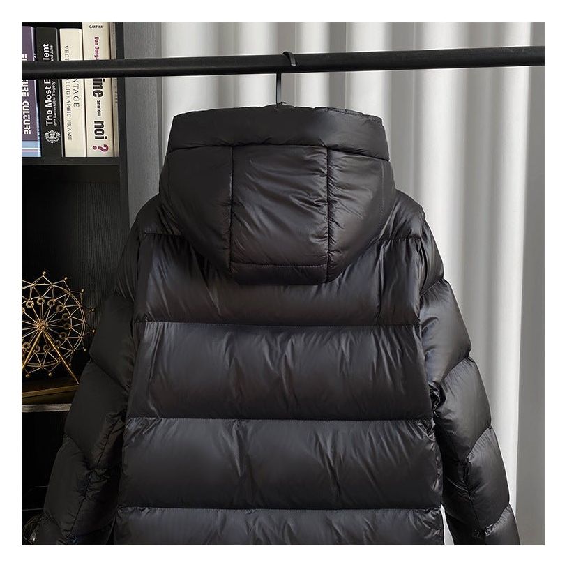 Sophisticated women's winter coat, elegant quilted design with a hood.