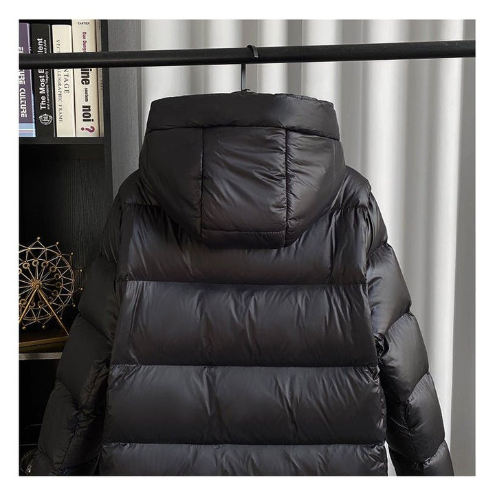 Sophisticated women's winter coat, elegant quilted design with a hood.