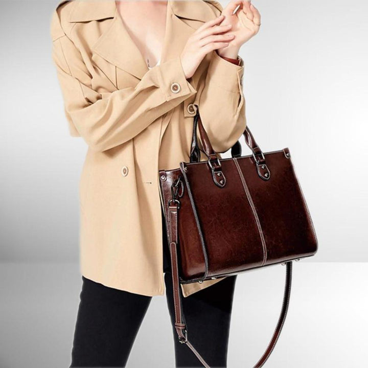 Functional women's elegant leather tote bag with organizer & secure zipper, ideal everyday shoulder bag.