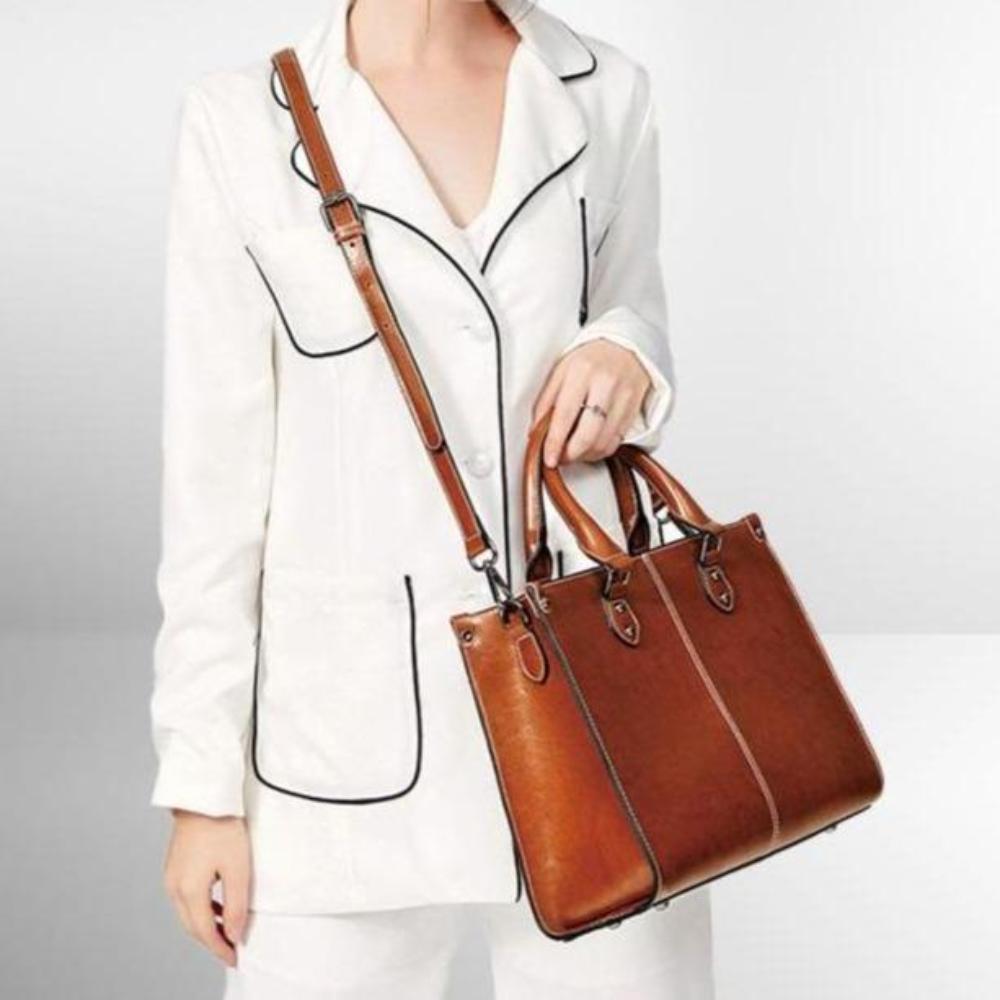 Sophisticated women's leather tote handbag for work or daily, featuring a zipper closure and comfortable shoulder straps.