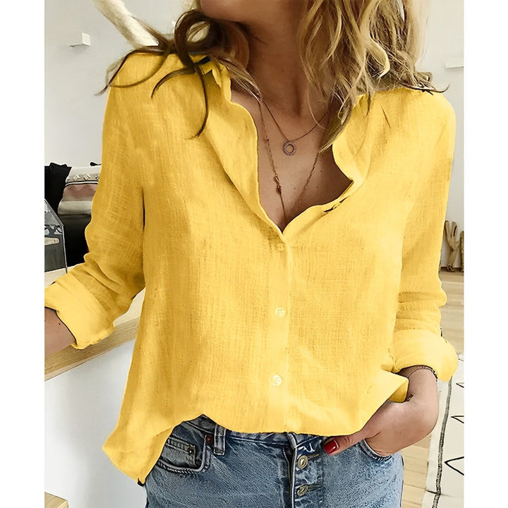 Stylish women's relaxed fit long sleeve button-up shirt, ideal casual blouse or office wear. Ladies fashion.