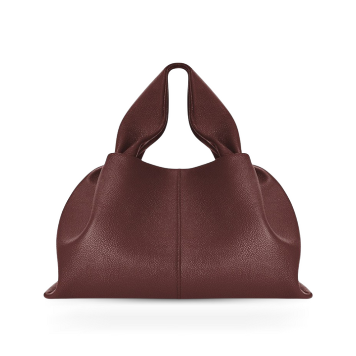 Elegant women's faux leather shoulder bag with a practical magnetic closure for everyday versatility.