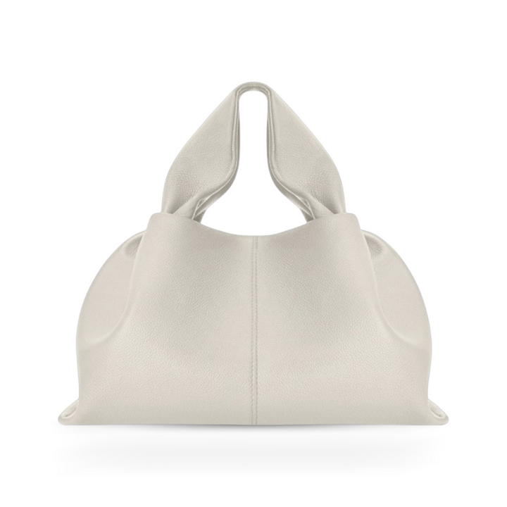 Sophisticated women's magnetic handbag, a durable faux leather shoulder bag for elegant daily use.