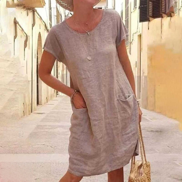 Stylish women's short sleeve everyday dress, a comfortable and elegant tunic for spring and summer casual wear.