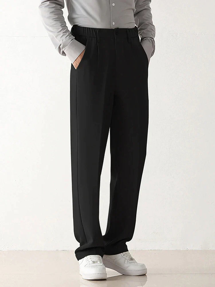 Versatile men's black relaxed fit tailored chino pants, suitable for formal business or smart casual outfits.