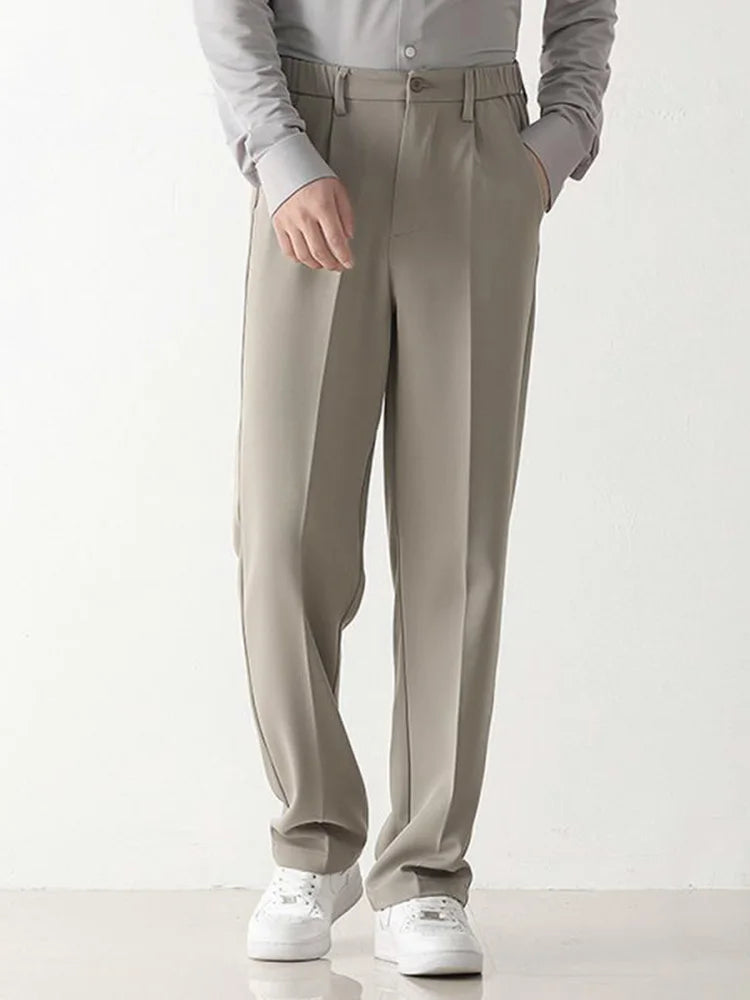Tailored men's draped pants, black, offering a comfortable relaxed fit for both business and casual wear.