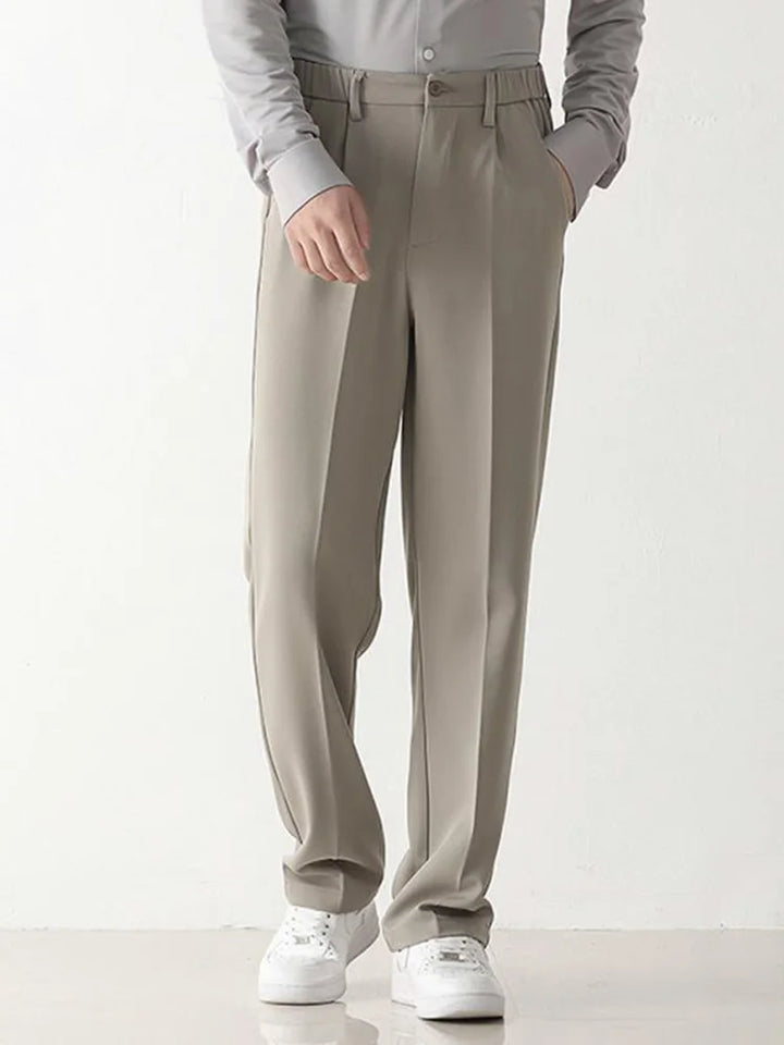 Tailored men's draped pants, black, offering a comfortable relaxed fit for both business and casual wear.