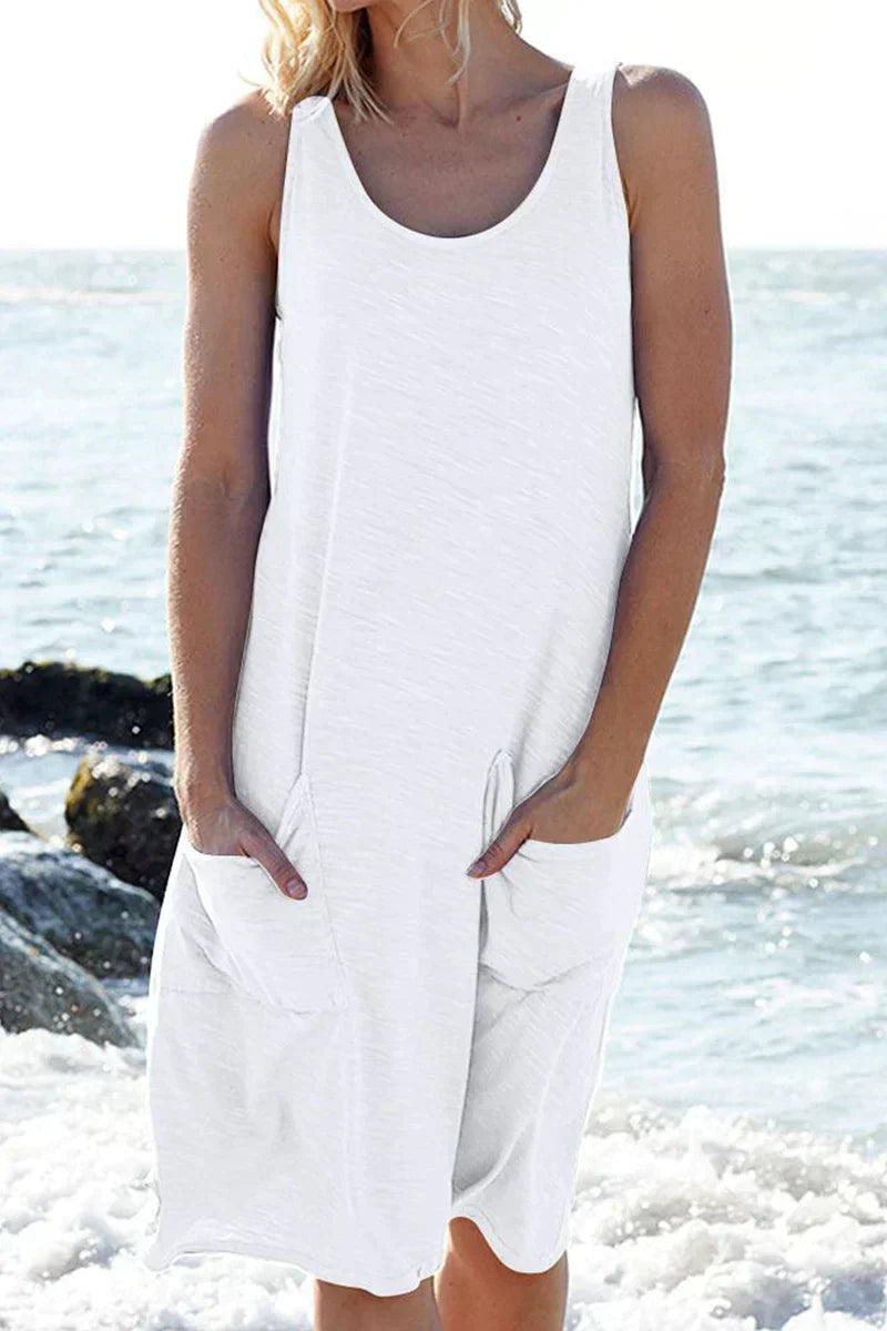 Elegant women's flowy beach dress in light fabric, perfect for summer vacation and resort wear.
