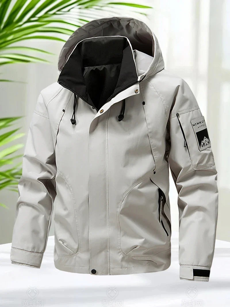 Men's waterproof hooded jacket, versatile softshell for hiking, travel, and everyday wear.