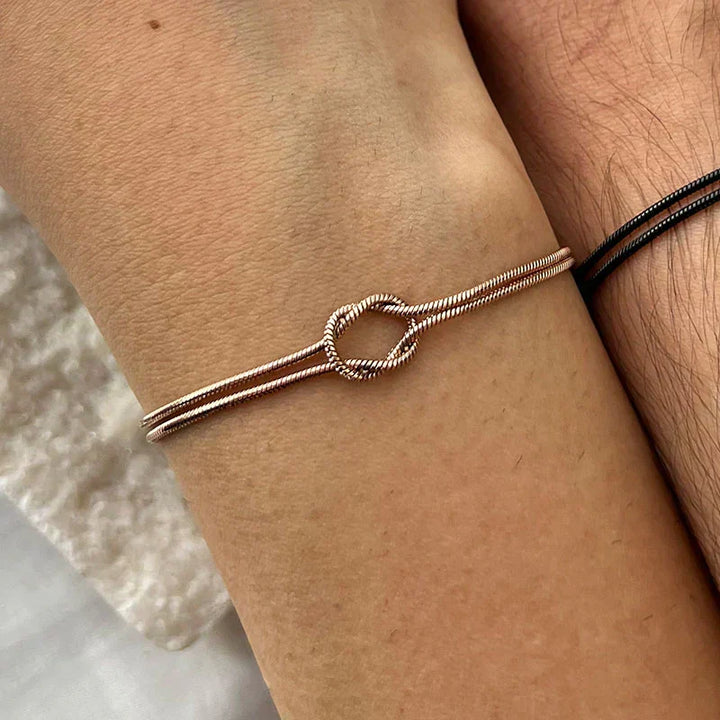 Delicate pink stainless steel knot bracelet for women. Elegant & refined minimalist jewelry, perfect for her.