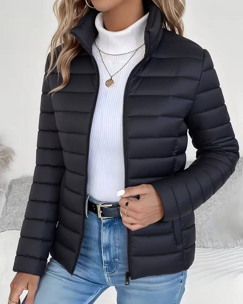 Trendy women's cropped puffer jacket. Lightweight and warm, perfect casual outerwear with a stand collar.