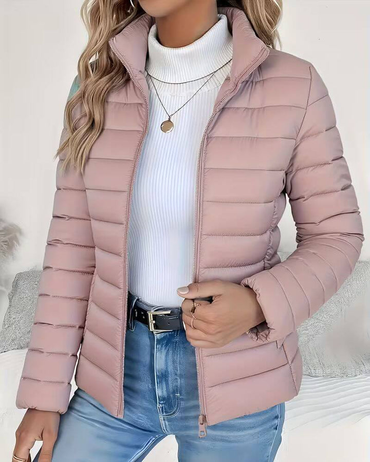 Lightweight women's cropped puffer jacket, featuring a chic stand collar. Ideal for trendy winter fashion.