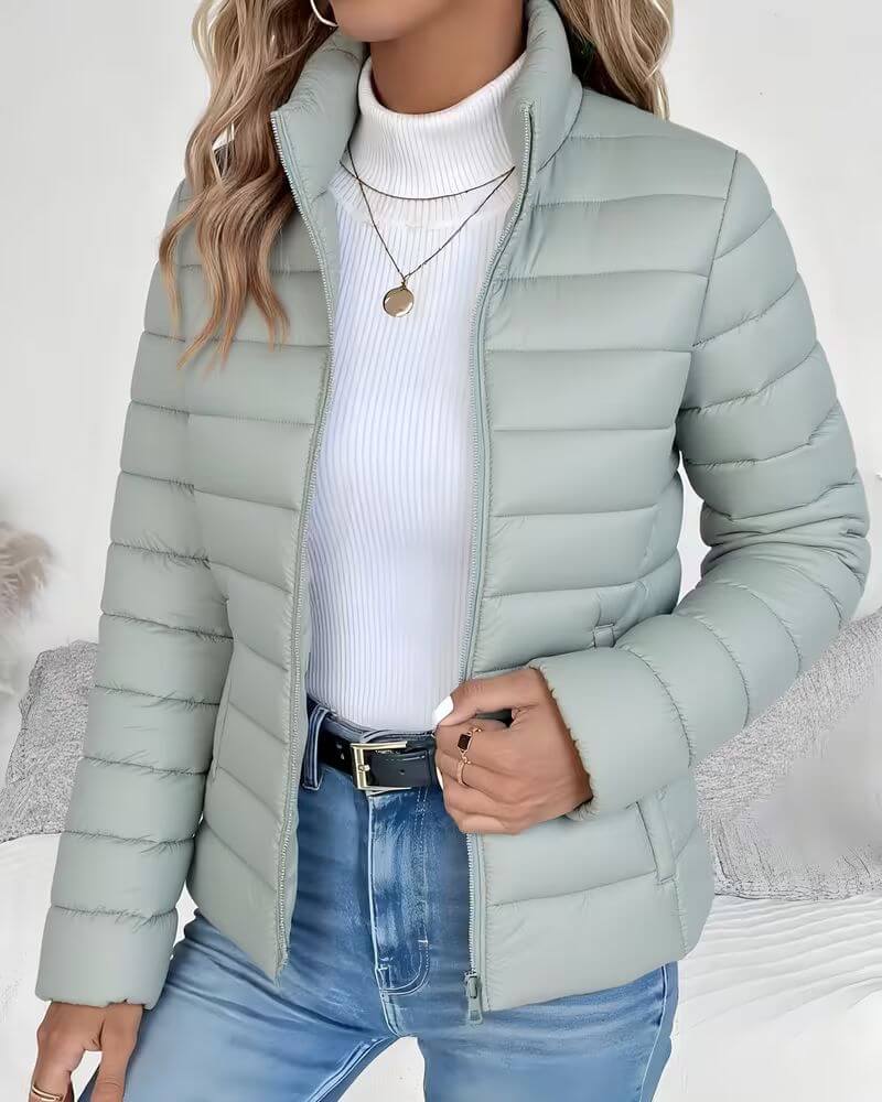 Women's cropped lightweight puffer jacket with a stylish stand collar for autumn and winter fashion.