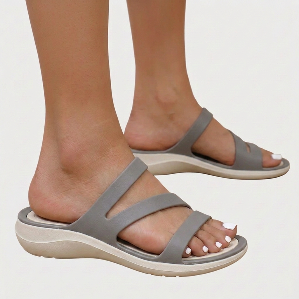 Casual women's open-toe sandals featuring multi-straps & orthopaedic comfort. Perfect flat footwear for summer ease.