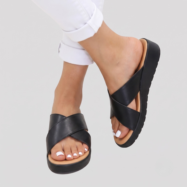 Casual women's cross-strap sandals, offering orthopaedic comfort & foot support. Ideal summer holiday slip-ons.