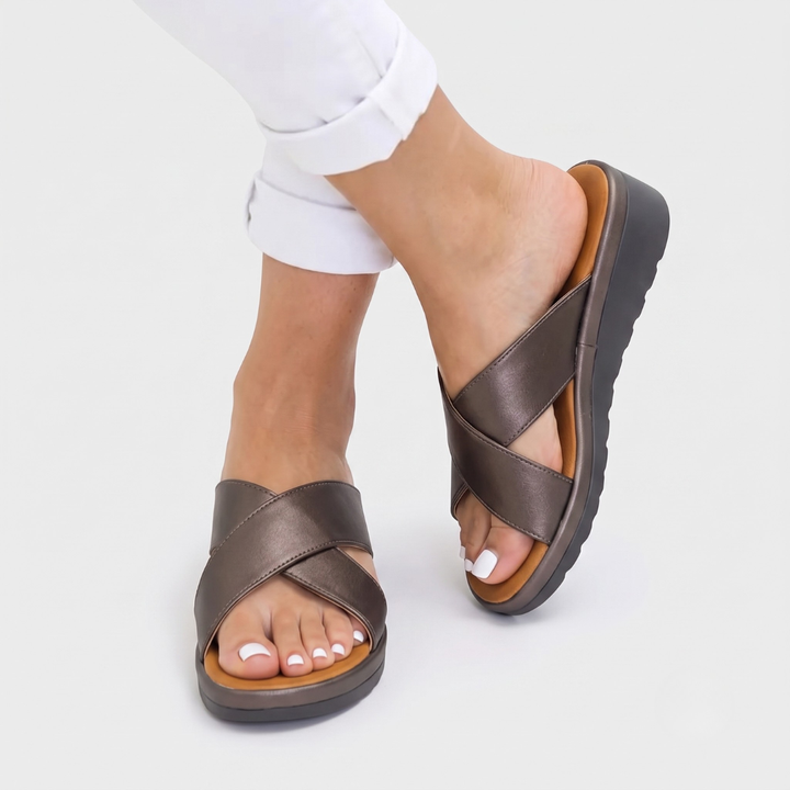 Stylish flat women's comfort sandals for summer. Orthopaedic footwear with foot support, great for everyday wear.