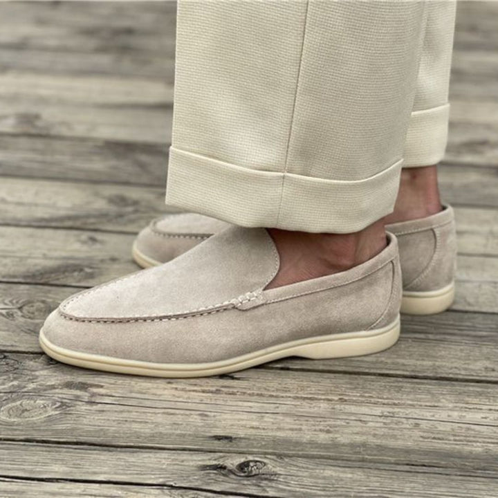 Modern men's grey canvas slip-on loafers, ideal for walking and comfortable everyday use.