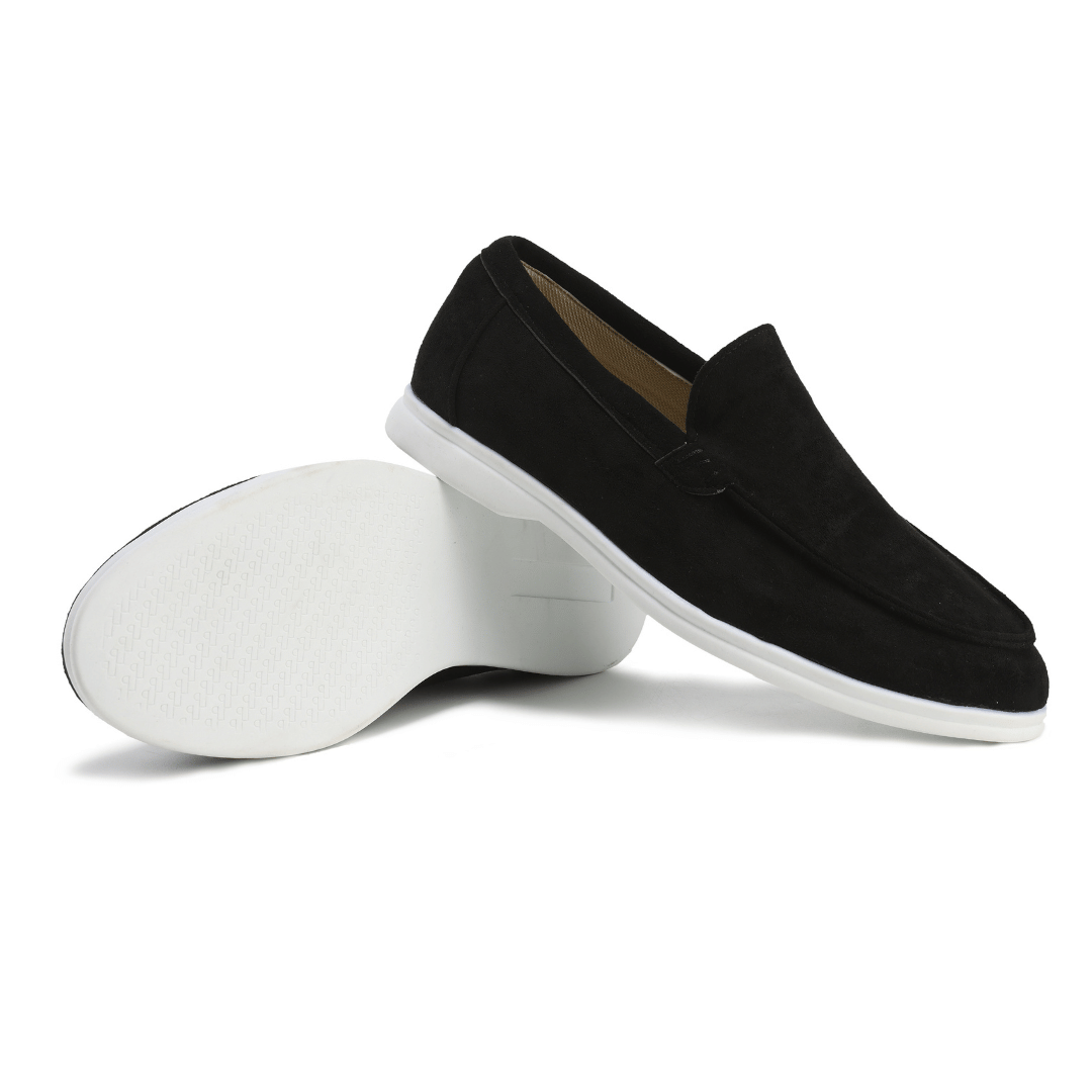 Minimalist black leather slip-on loafers for men, combining fashion, comfort, & versatility.