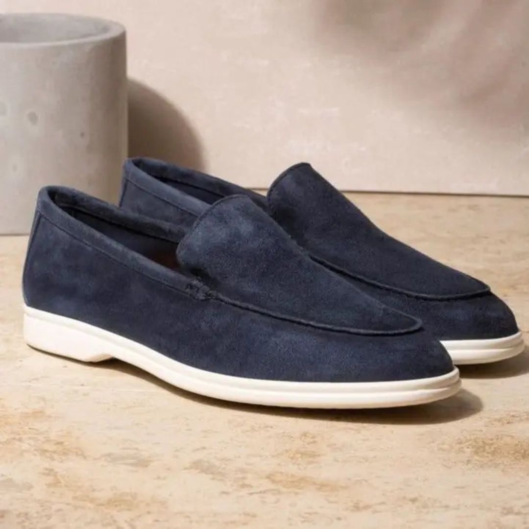 Stylish men's grey slip-on walking loafers, offering comfort and modern design for daily use.