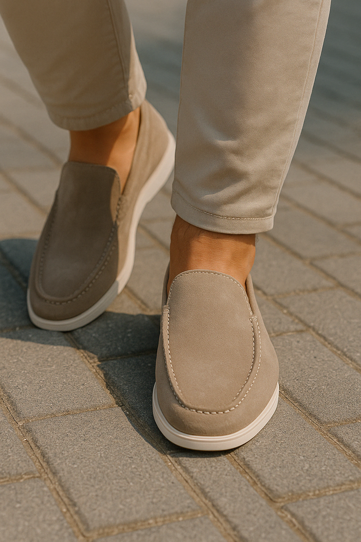 Comfortable men's slip-on loafers with flat sole & round toe for all-day wear.