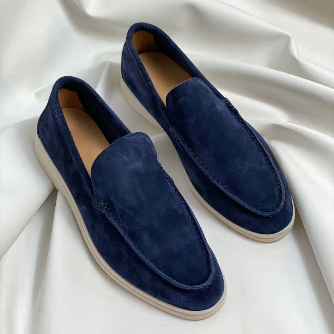 Round toe men's slip-on loafers with flat sole and subtle stitched detail.