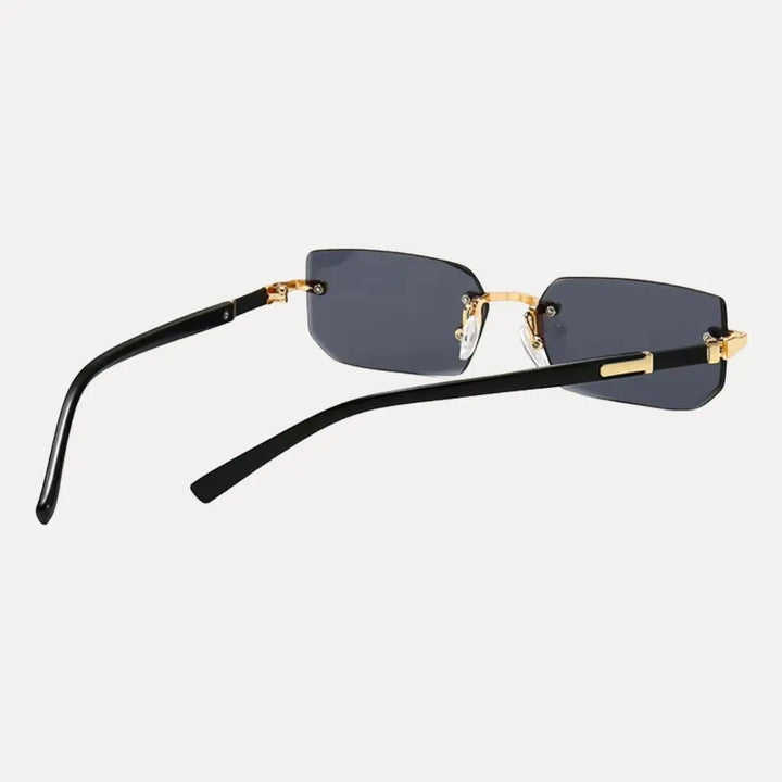 Minimalist men's rimless rectangle sunglasses with a polished gold frame, for a sleek, modern aesthetic.