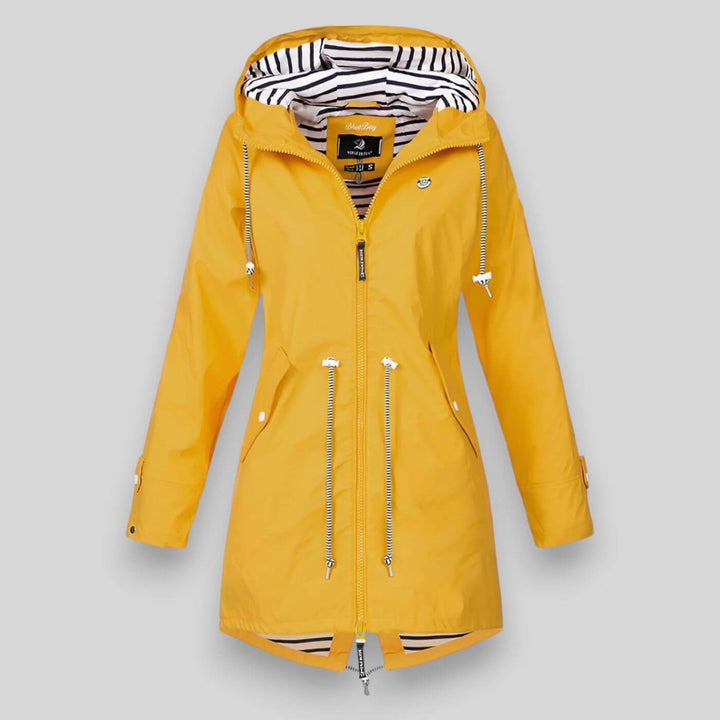 Lightweight women's waterproof hooded jacket, ideal for outdoor adventures, everyday wear, & staying dry.