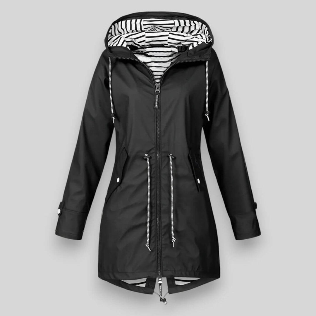 This women's sleek waterproof rain jacket combines fashion & function, an essential hooded outerwear for dry comfort.