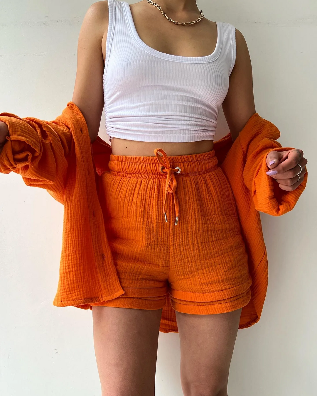 Fashionable women's summer outfit, a lightweight short set perfect for warm weather.