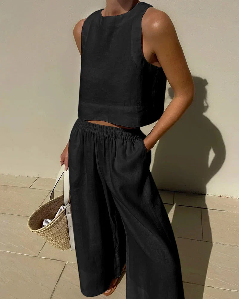Relaxed fit women's sleeveless top & comfortable wide-leg capri pants set. Ideal casual summer wear.