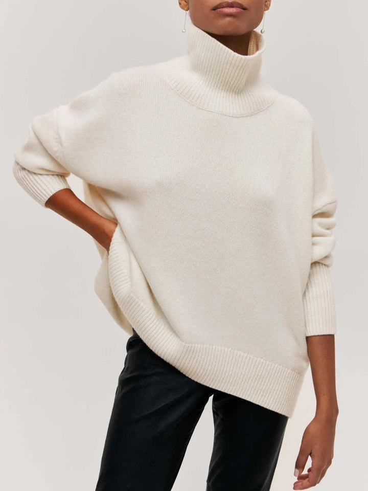 Women's cozy oversized turtleneck sweater, relaxed fit, stylish top with elbow slit, perfect for fall/winter.