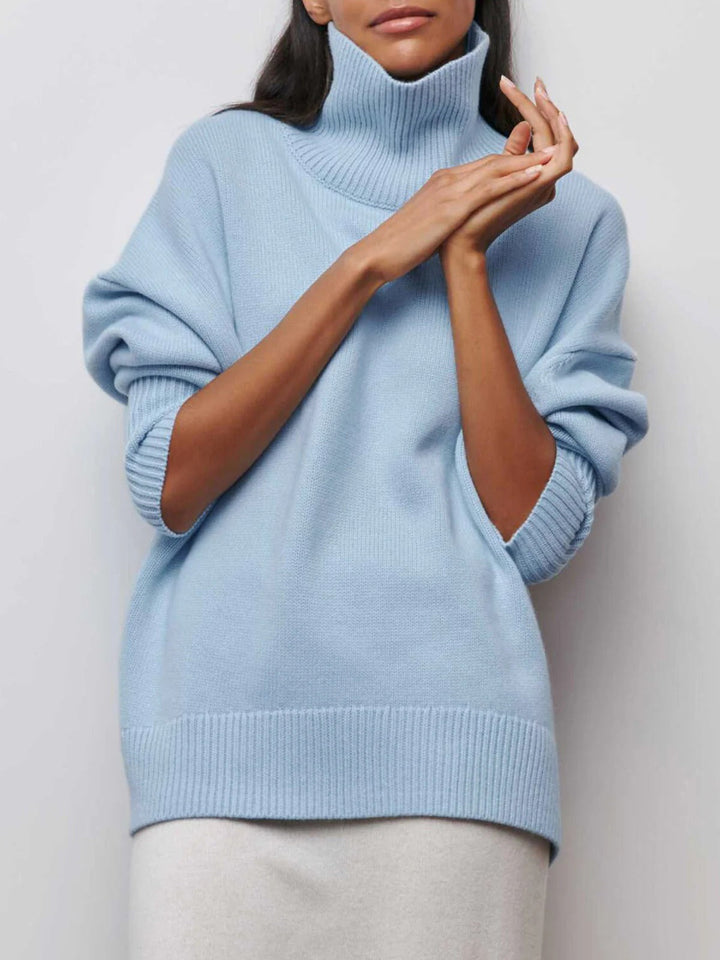 Women's oversized turtleneck sweater, cozy knit for fall/winter, relaxed fit, casual chic style.